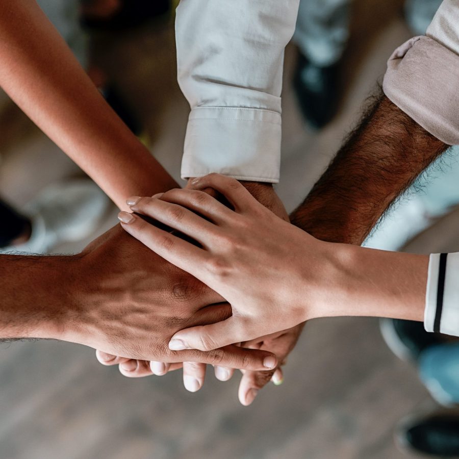 Cooperation.,Top,View,Of,People,Holding,Hands,Together,While,Standing Cooperation.,Top,View,Of,People,Holding,Hands,Together,While,Standing